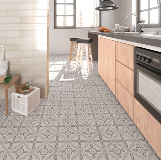 Carrelage TERCELLO HUMO 20x20 Grés Cérame émaillé MAT de la marque Vives présente un motif ornemental rétro avec une texture subtile rappelant l'effet TERRAZZO ou le carreau de ciment traditionnel.